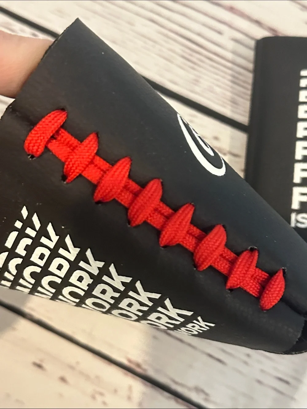 Coca Cola Black Can Cooler with Red Football Lace-up Detail